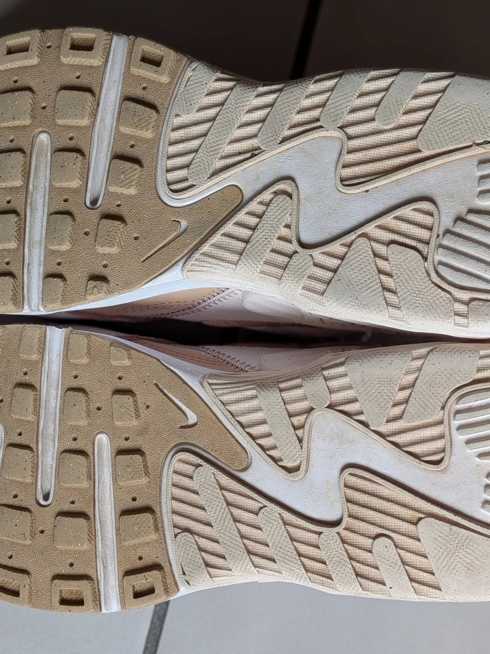 Nike Women’s Sneakers in Blush with Metallic Rose Accent